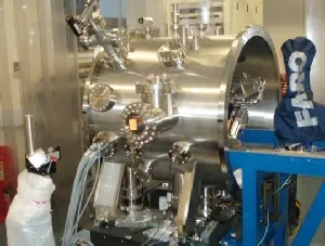 Double crystal monochromator vessel under test beside a portable CMM arm