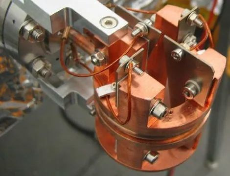 Tungsten vane beam position monitor in its copper mount